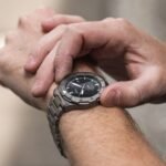 A man Evaluating his Watch's Quality