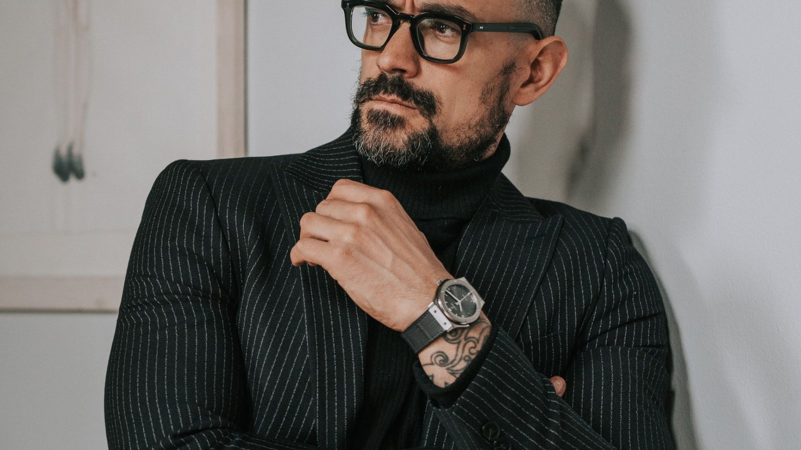 A man Pairing his Watch with the Outfit he's wearing